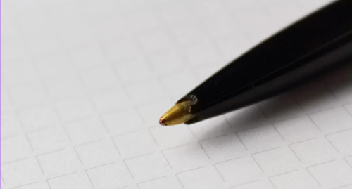 A pen tip on a surface