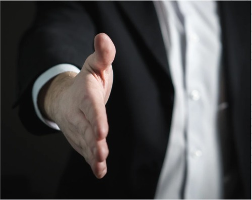A hand stretched out offering a handshake